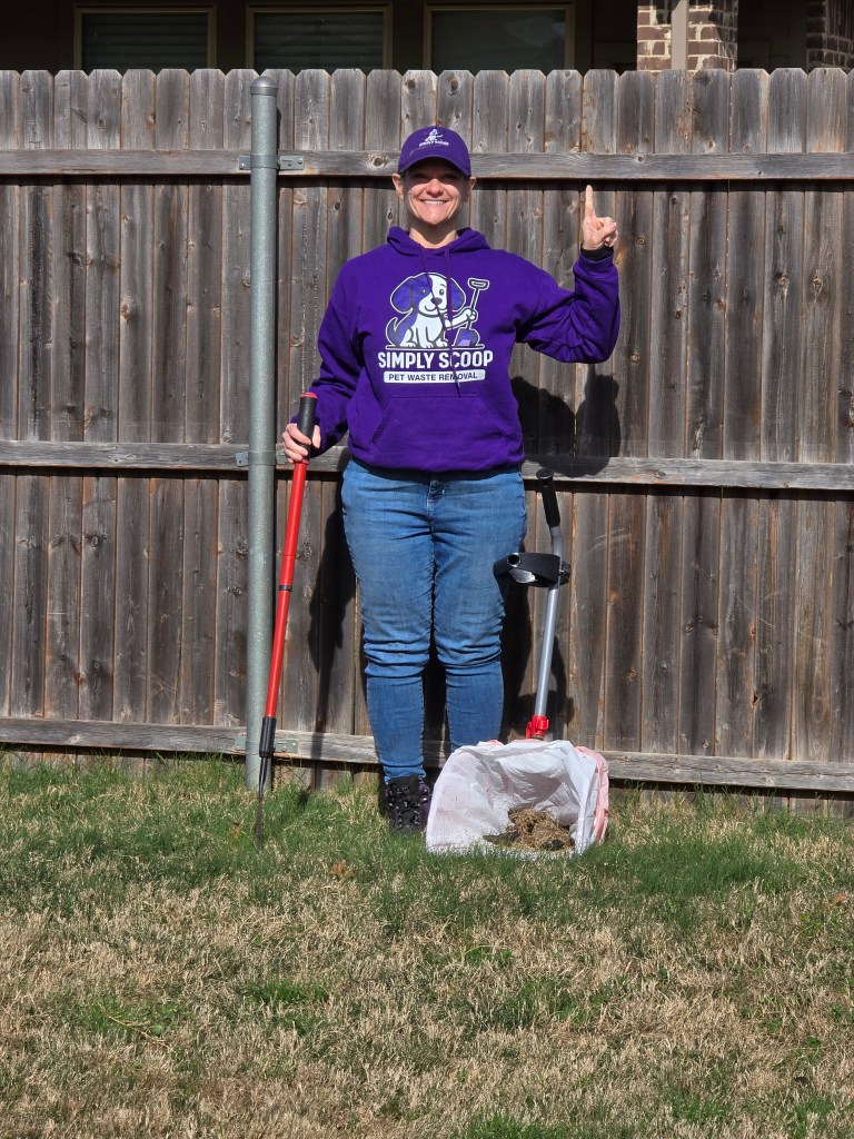 Person holding tools near fence